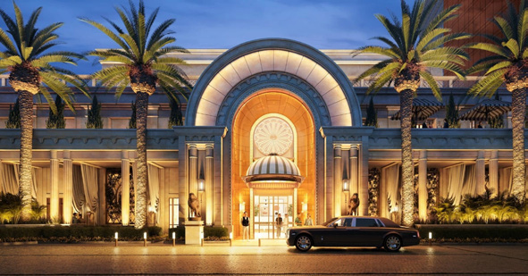 Grand illuminated entrance of Wynn Al Marjan Island integrated resort